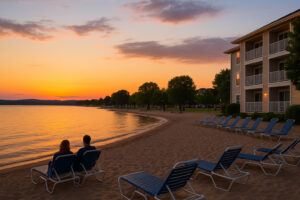 The Beach Hotel Traverse City Michigan overlooking Grand Traverse Bay with sandy shoreline and sunset views.