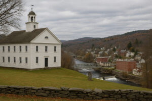 Scenic downtown riverfront view in Bellows Falls VT with historic buildings and bridge