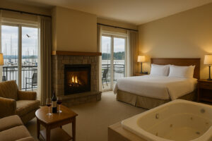 Scenic view of Port Ludlow Resort overlooking the marina, surrounded by lush forests and calm waters under a soft evening sky.