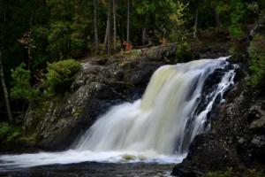 A thrilling series of rapids and drops in a rocky gorge, popular with kayakers and hikers, accessible via a forest trail near Marquette.