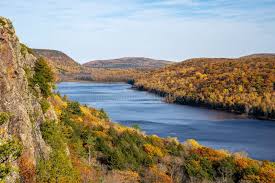 Miles of pristine Lake Michigan coastline with sandy coves, marshlands, and starry night skies.