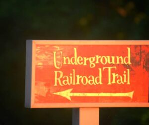 Historical Underground Railroad Trail in Ohio, highlighting a pathway through forests and fields that symbolize freedom and resilience.