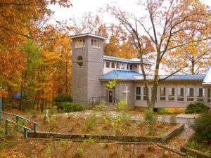 The University of the South campus in Sewanee, Tennessee, surrounded by lush greenery.