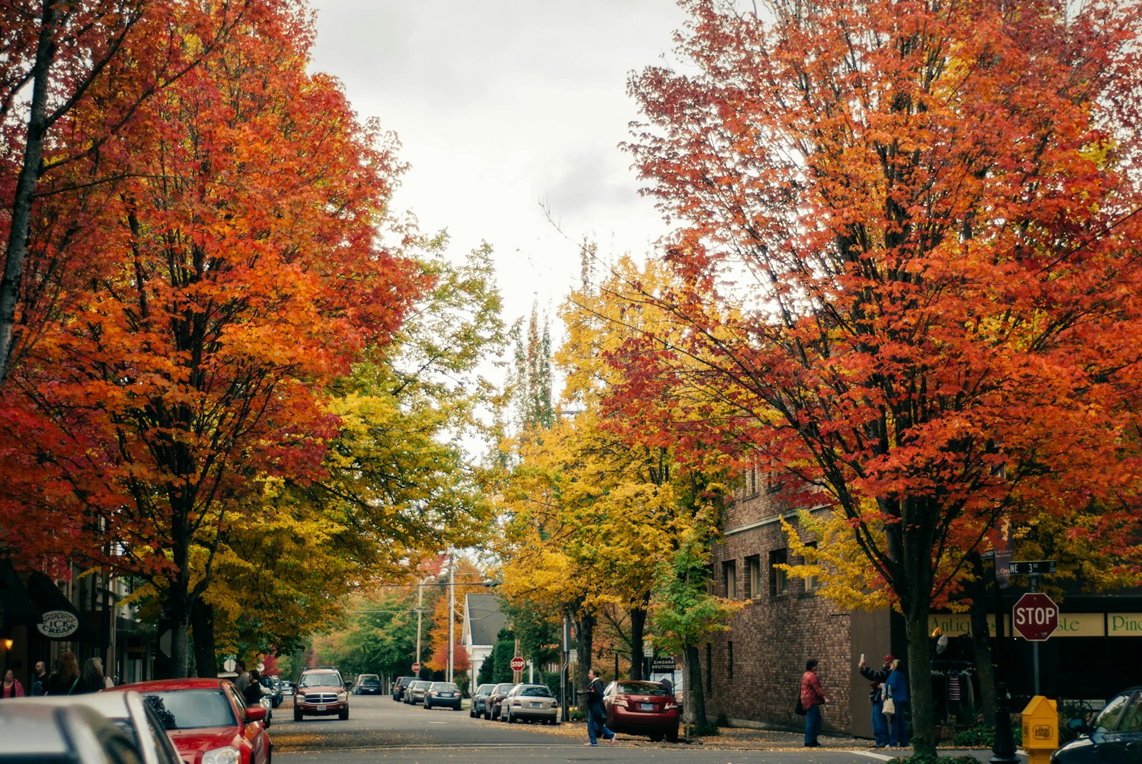 a street with cars parked on the side of it